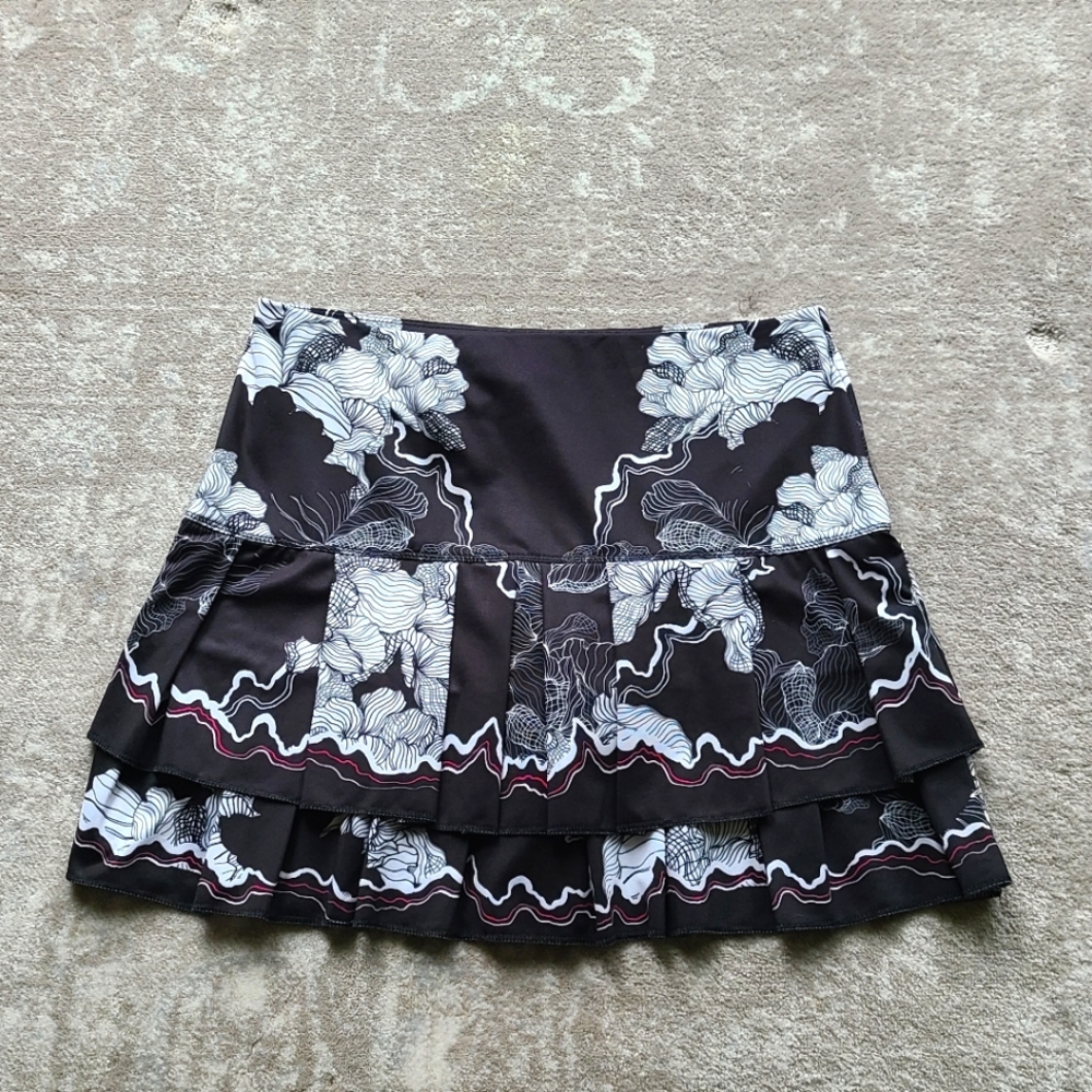 Black floral Lucky in Love tennis skirt.